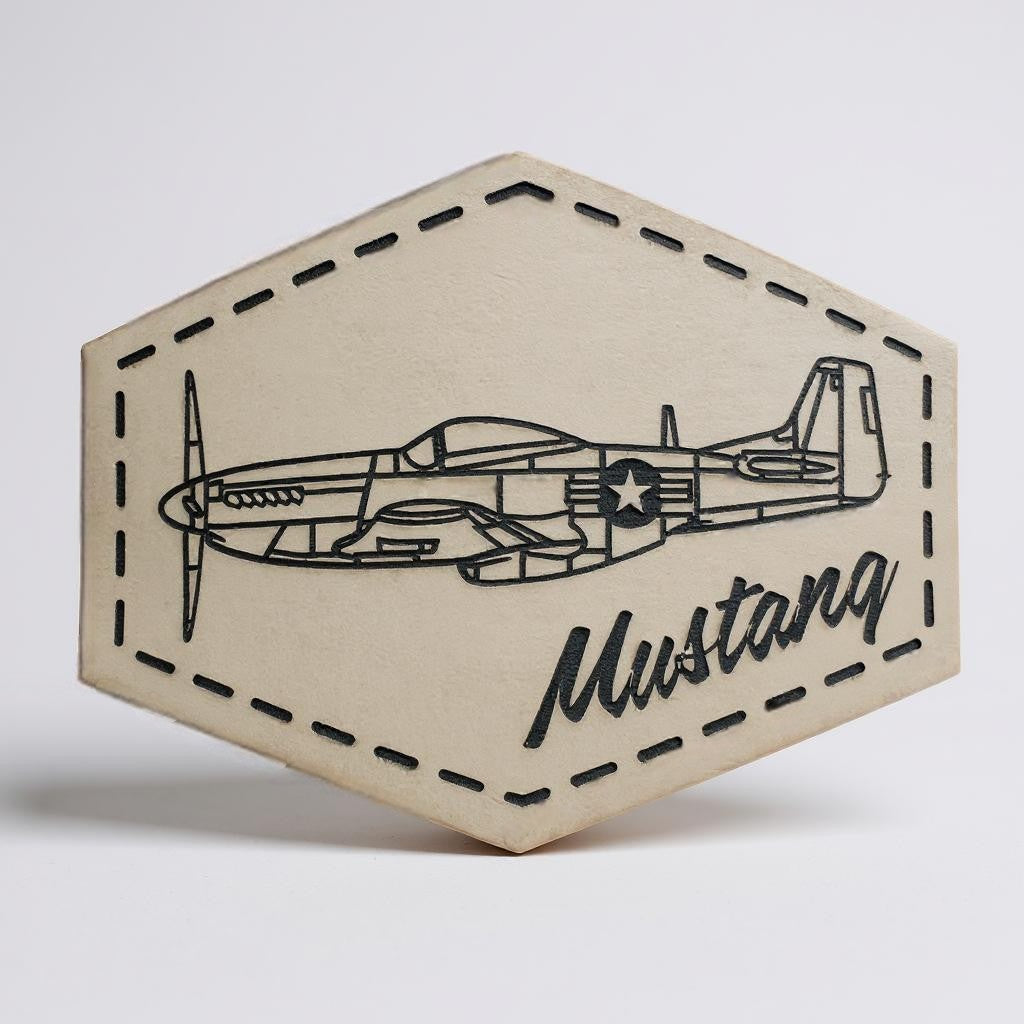 Hexagonal beige cutout with airplane design and 'Mustang' text on a light gray background