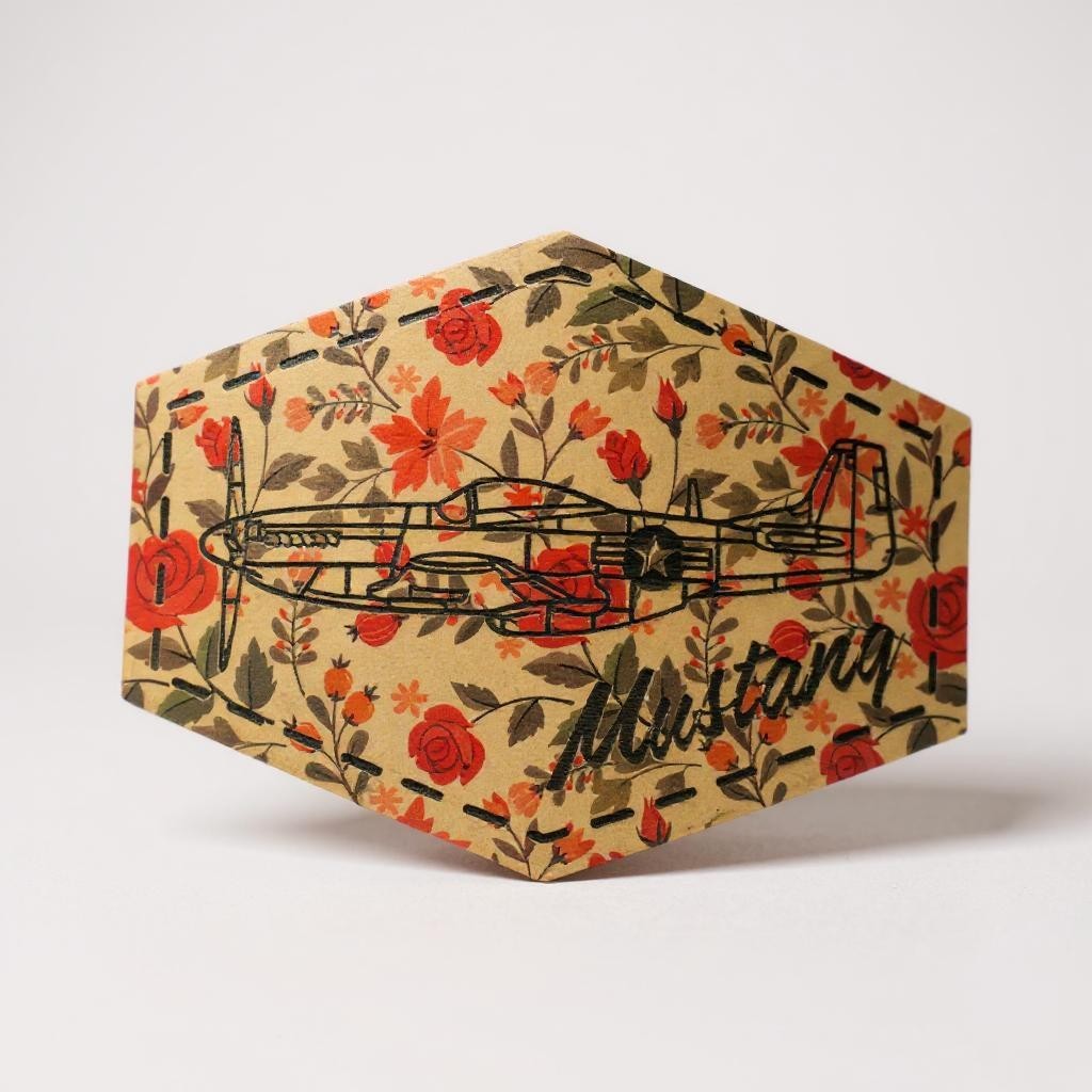 Hexagonal patch with floral design and 'Mustang' text and airplane on a white background